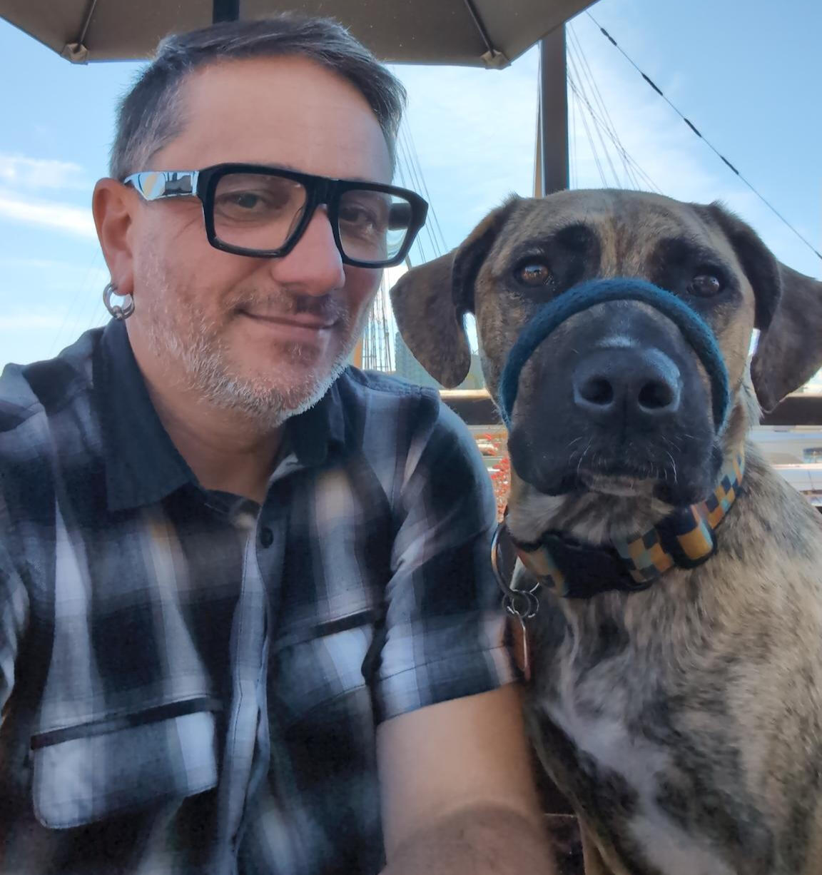 a picture of Bruno Trigo, and their dog Oskala